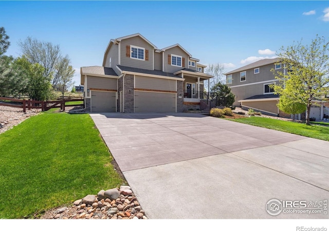 view of front facade featuring fence, an attached garage, a front lawn, and concrete driveway