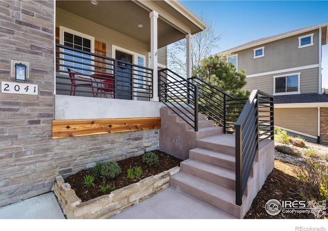 view of exterior entry featuring a porch