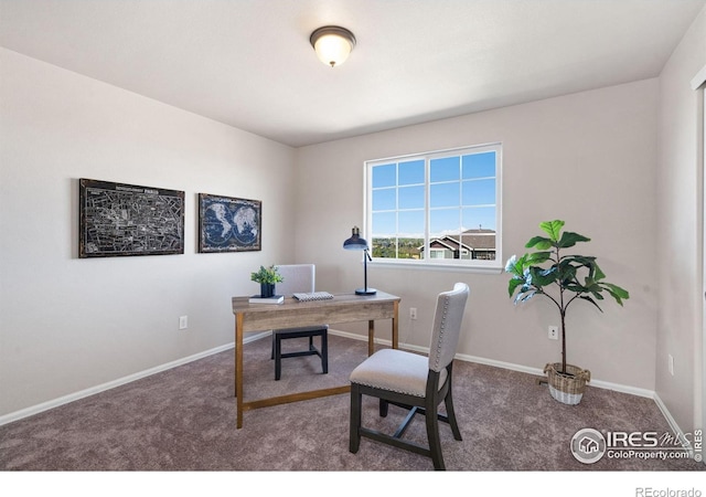 carpeted home office with baseboards