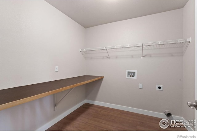 clothes washing area with baseboards, hookup for a washing machine, laundry area, and dark wood-style floors