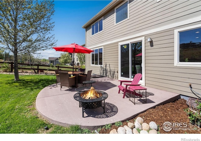 view of patio with a fire pit