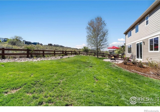 view of yard featuring a fenced backyard and a patio