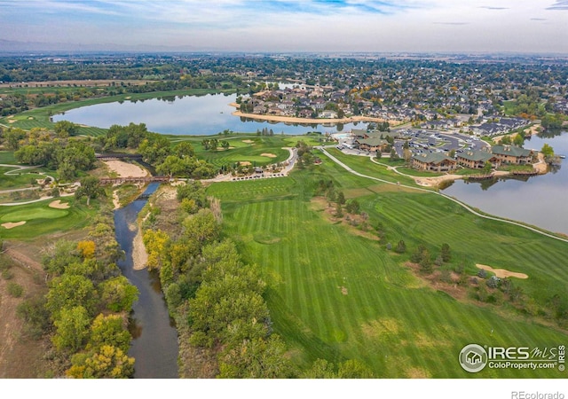 aerial view featuring a water view, a residential view, and view of golf course