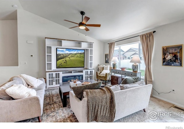 carpeted living room featuring baseboards, visible vents, a ceiling fan, and lofted ceiling