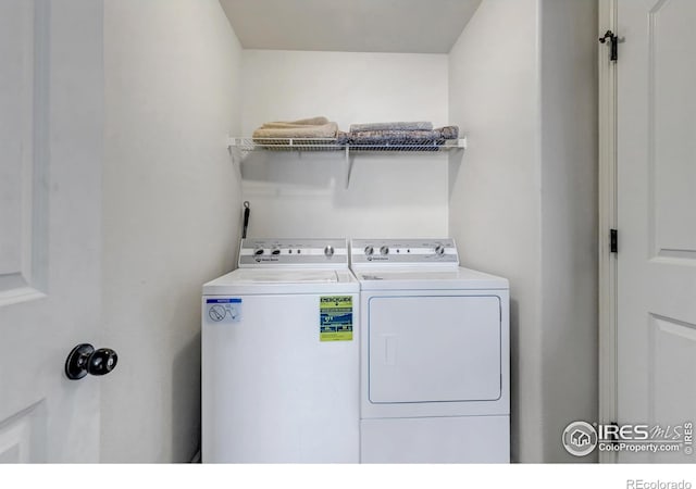 laundry room with laundry area and washer and clothes dryer