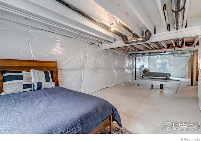 bedroom featuring concrete flooring