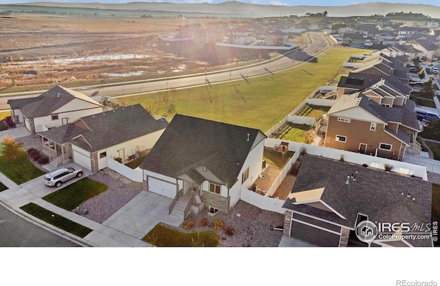 drone / aerial view with a residential view and a mountain view