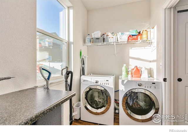 washroom with laundry area and separate washer and dryer