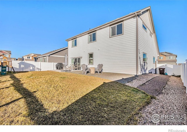 back of property with a residential view, a fenced backyard, a playground, a yard, and a patio