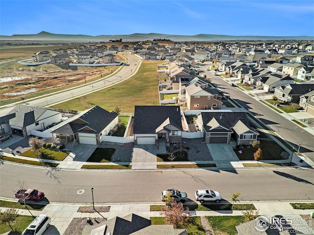 birds eye view of property with a residential view and a mountain view