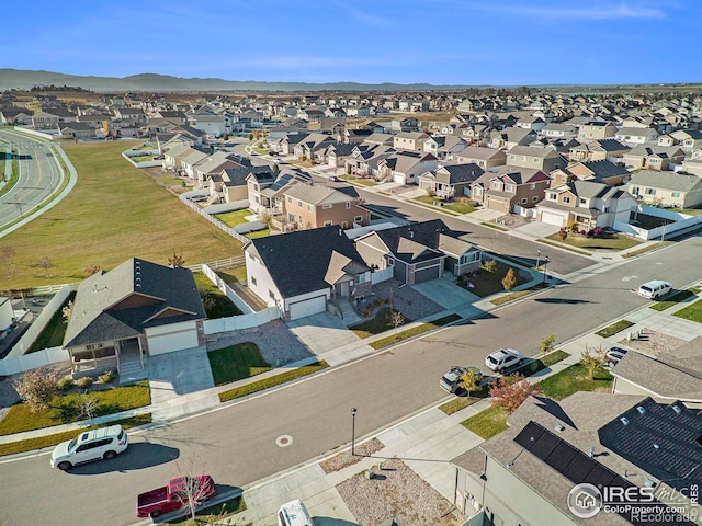 birds eye view of property with a residential view and a mountain view