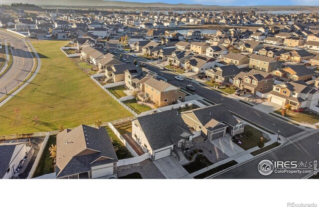 birds eye view of property with a residential view