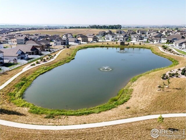 aerial view with a water view and a residential view