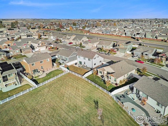 birds eye view of property with a residential view