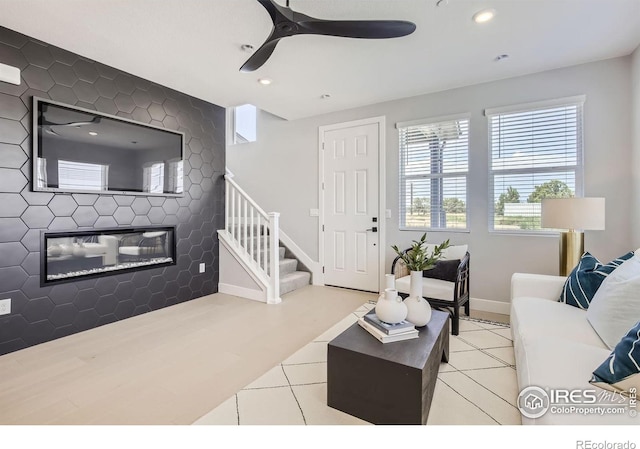 living room featuring recessed lighting, ceiling fan, tile patterned flooring, and stairway