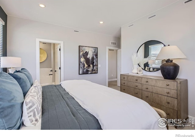 bedroom with baseboards and visible vents