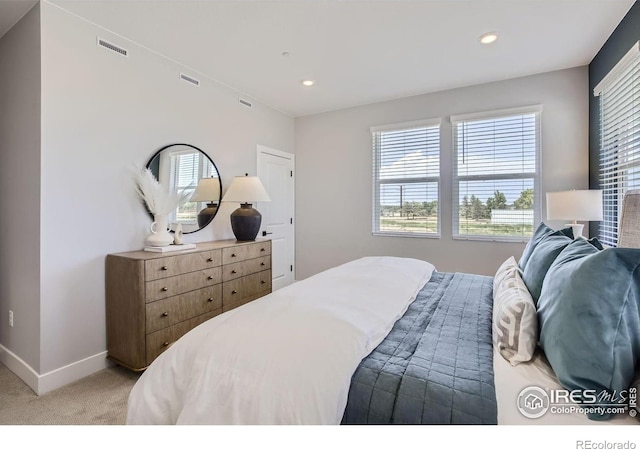 bedroom featuring recessed lighting, baseboards, visible vents, and light carpet