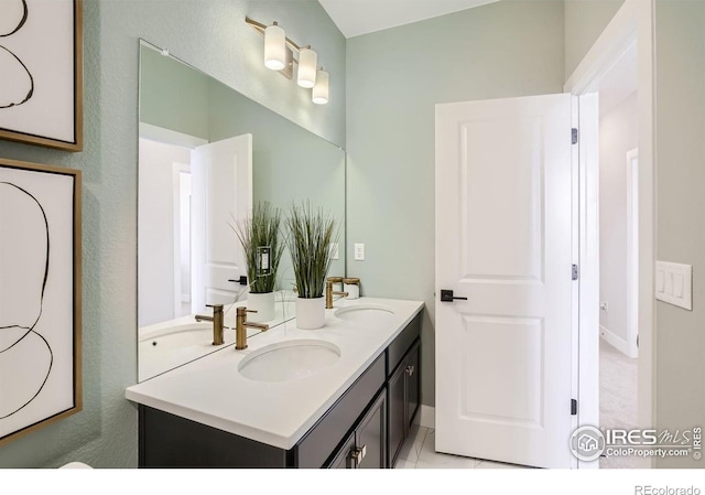 bathroom featuring a sink, tile patterned flooring, and double vanity