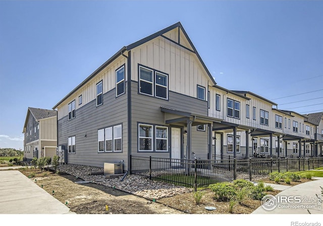 multi unit property with fence private yard and board and batten siding
