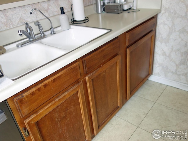 6036 Gunbarrel Ave Unit B, Boulder, CO 80301 - interior space featuring light countertops, baseboards, brown cabinets, and a sink