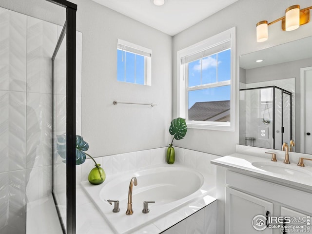full bathroom featuring vanity, a stall shower, recessed lighting, and a bath