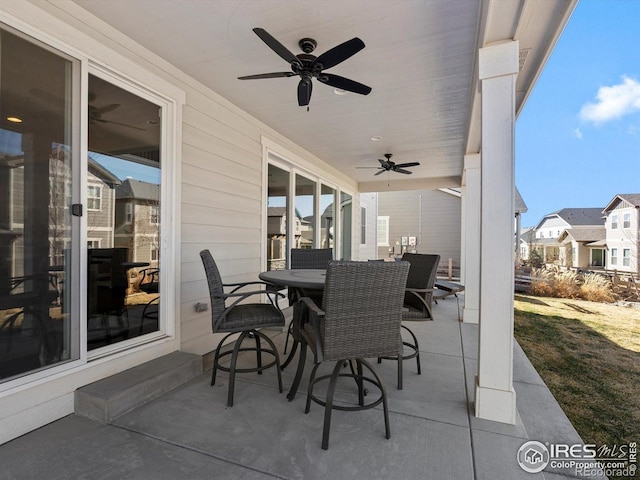 view of patio featuring a ceiling fan and outdoor dining space