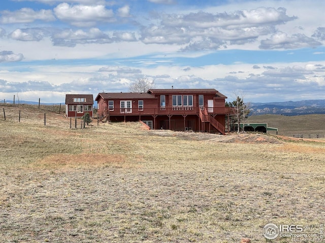 115 Arapaho Ridge Rd, Livermore, CO 80536 - rear view of property with a wooden deck and stairs