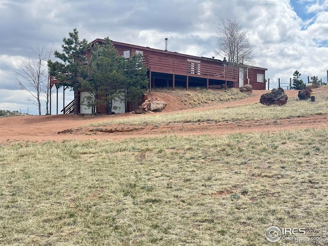 115 Arapaho Ridge Rd, Livermore, CO 80536 - view of yard with a wooden deck