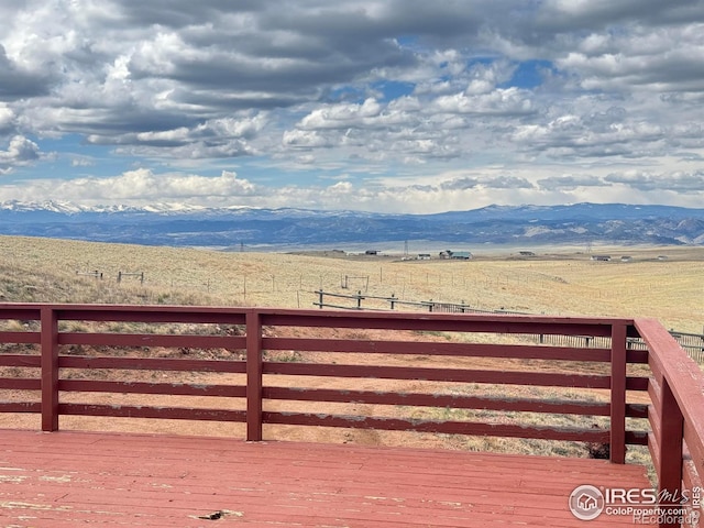 115 Arapaho Ridge Rd, Livermore, CO 80536 - wooden terrace with a mountain view and a rural view