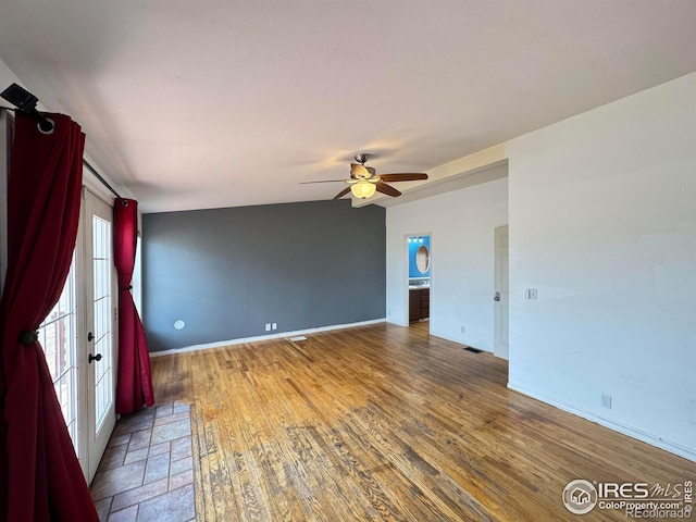 115 Arapaho Ridge Rd, Livermore, CO 80536 - unfurnished room with baseboards, ceiling fan, wood finished floors, and visible vents
