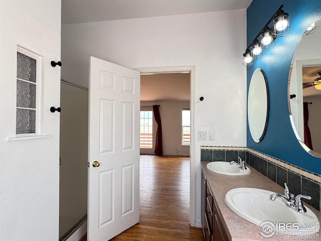 115 Arapaho Ridge Rd, Livermore, CO 80536 - bathroom with a sink, ceiling fan, double vanity, and wood finished floors
