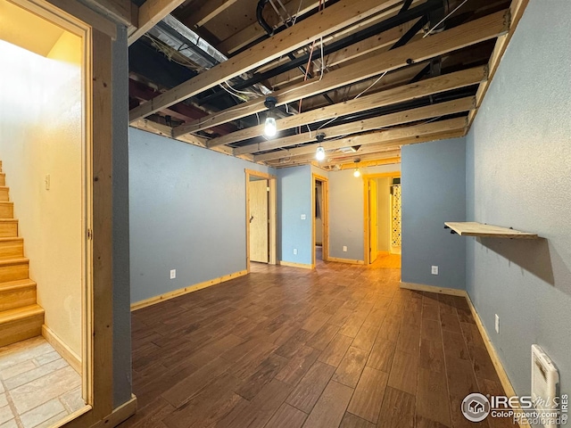 115 Arapaho Ridge Rd, Livermore, CO 80536 - finished below grade area featuring baseboards, stairs, and wood finished floors