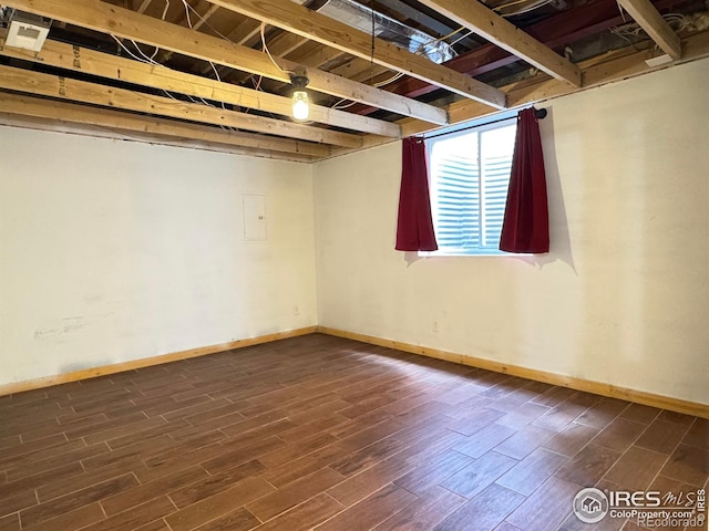 115 Arapaho Ridge Rd, Livermore, CO 80536 - below grade area featuring baseboards and dark wood-style flooring