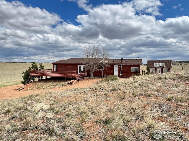 115 Arapaho Ridge Rd, Livermore, CO 80536 - rear view of house featuring a deck