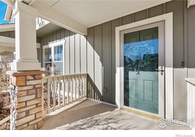 2832 William Neal Pkwy Unit C, Fort Collins, CO 80525 - view of exterior entry with a porch and board and batten siding