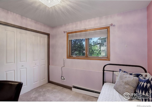3785 Birchwood Dr, Boulder, CO 80304 - bedroom featuring baseboards, light carpet, baseboard heating, and a closet