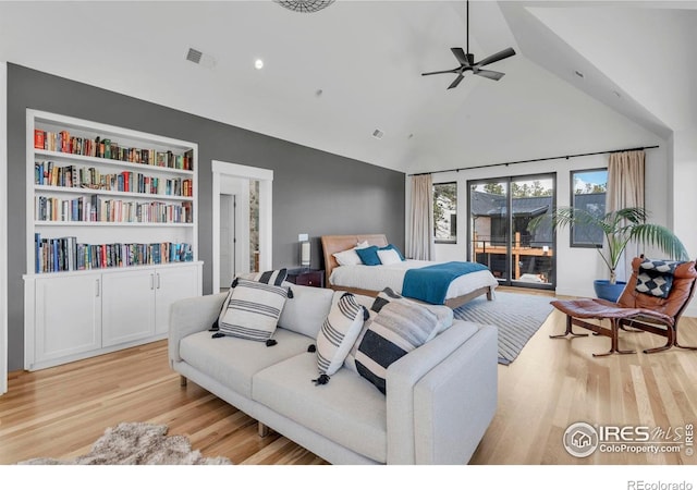 11 Juneau Cir, Nederland, CO 80466 - bedroom featuring visible vents, light wood finished floors, high vaulted ceiling, and access to exterior