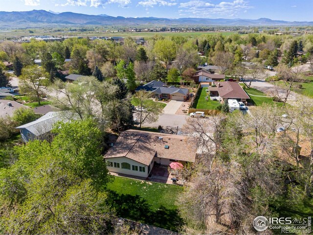 aerial view of residential area featuring mountains