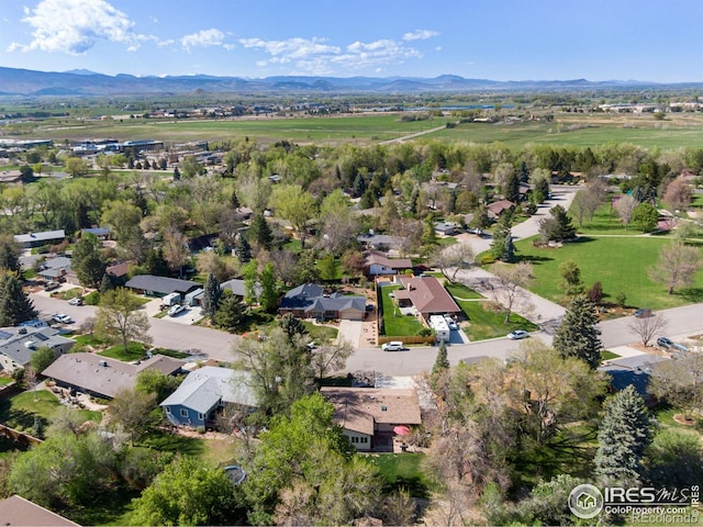 aerial perspective of suburban area with a mountainous background