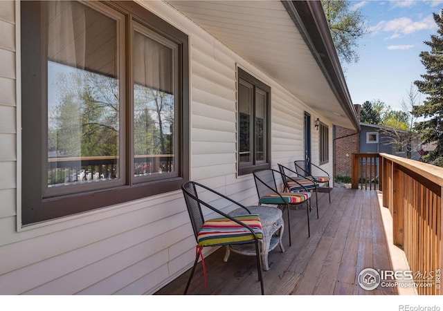 wooden terrace featuring a porch