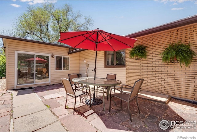 view of patio with outdoor dining area