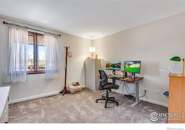 office space with carpet flooring and baseboards