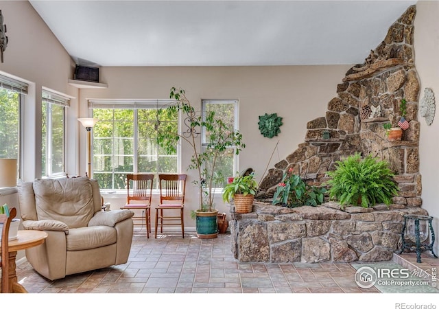 living room featuring stone finish floors