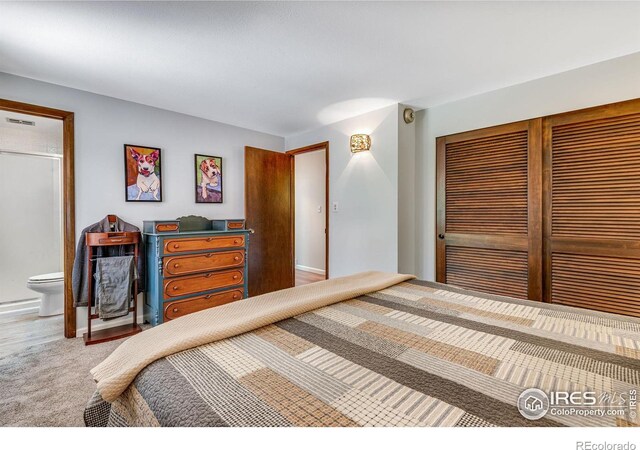 carpeted bedroom featuring a closet