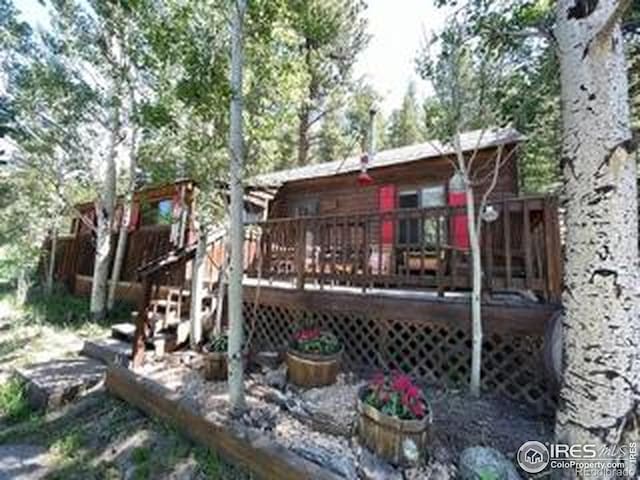 back of property featuring a wooden deck