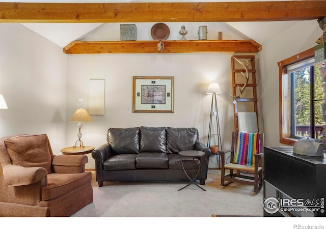 living area with lofted ceiling with beams and light carpet