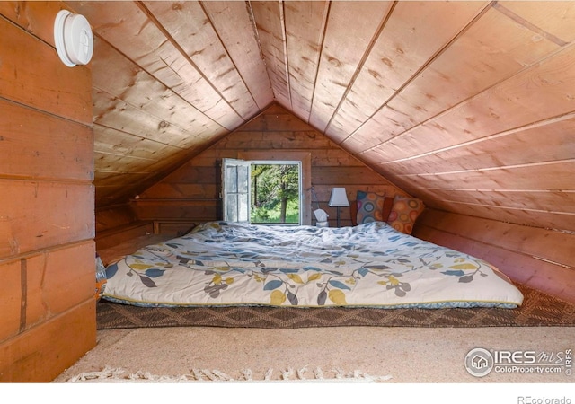 bedroom featuring vaulted ceiling and wooden ceiling