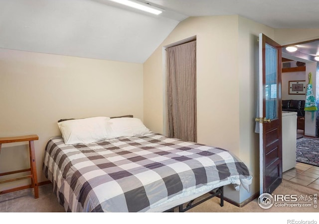 bedroom featuring baseboards, carpet, and lofted ceiling