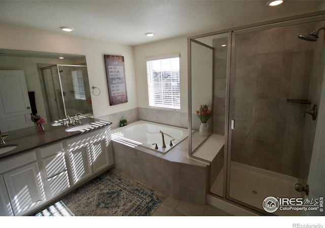 full bathroom featuring a garden tub, tile patterned floors, a stall shower, and recessed lighting