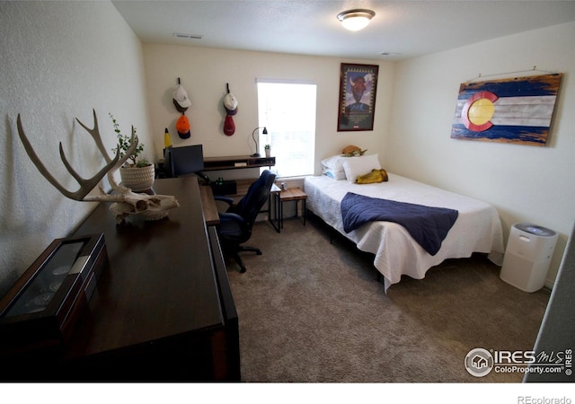 bedroom with visible vents and carpet floors